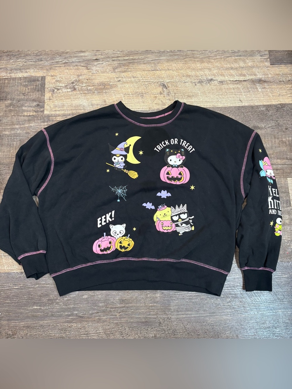 Sanrio Hello Kitty and Friends glow-in-the-dark Halloween graphic sweatshirt L